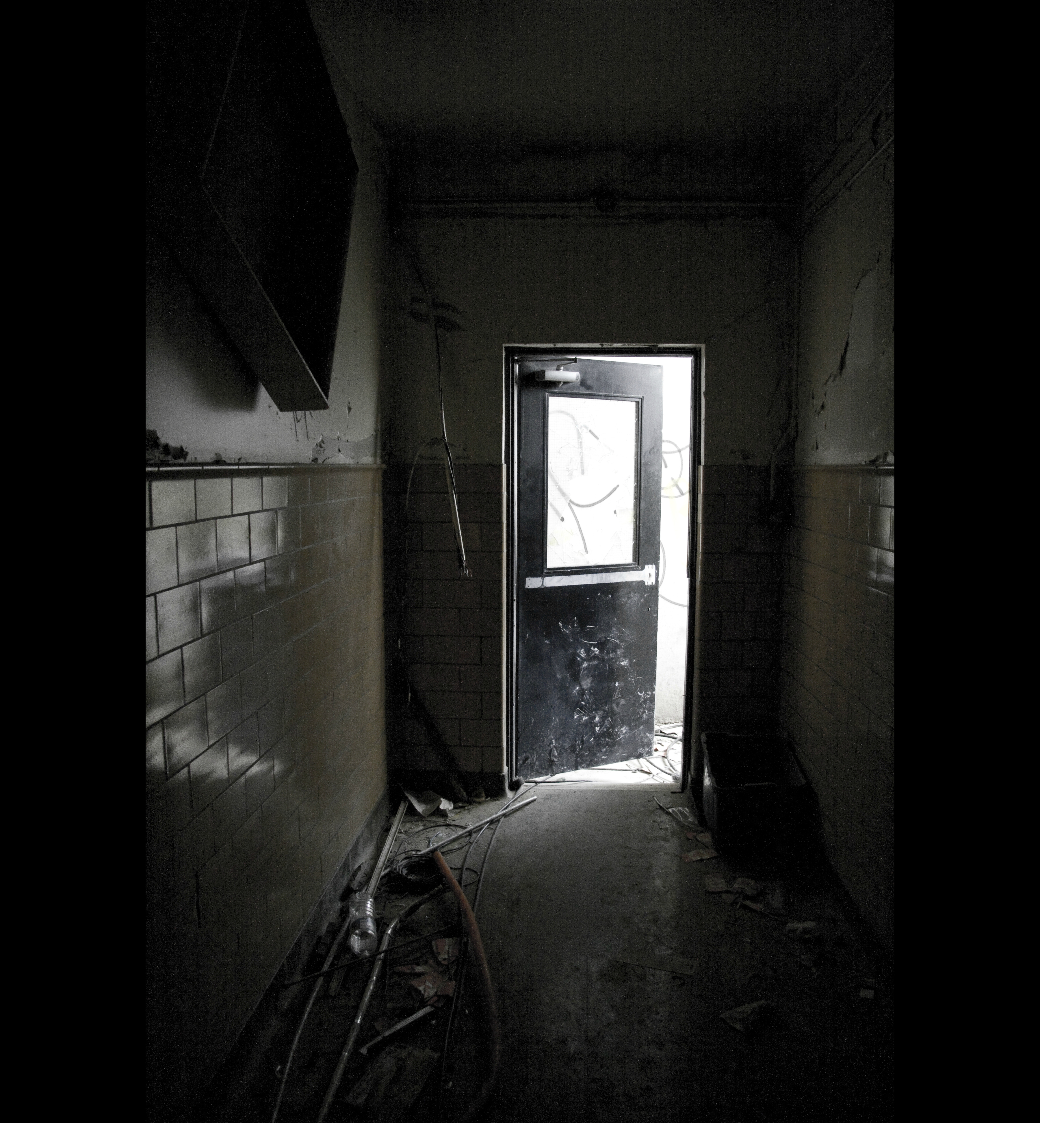 THE DARKNESS - Entering through the basement was scary. Only steps from the doorway, it was completely black. For a minute all was silent except the echoing creak of the building. Then there was the sound of a muffled thud from above. Then voices. Indistinct and quickly gone.