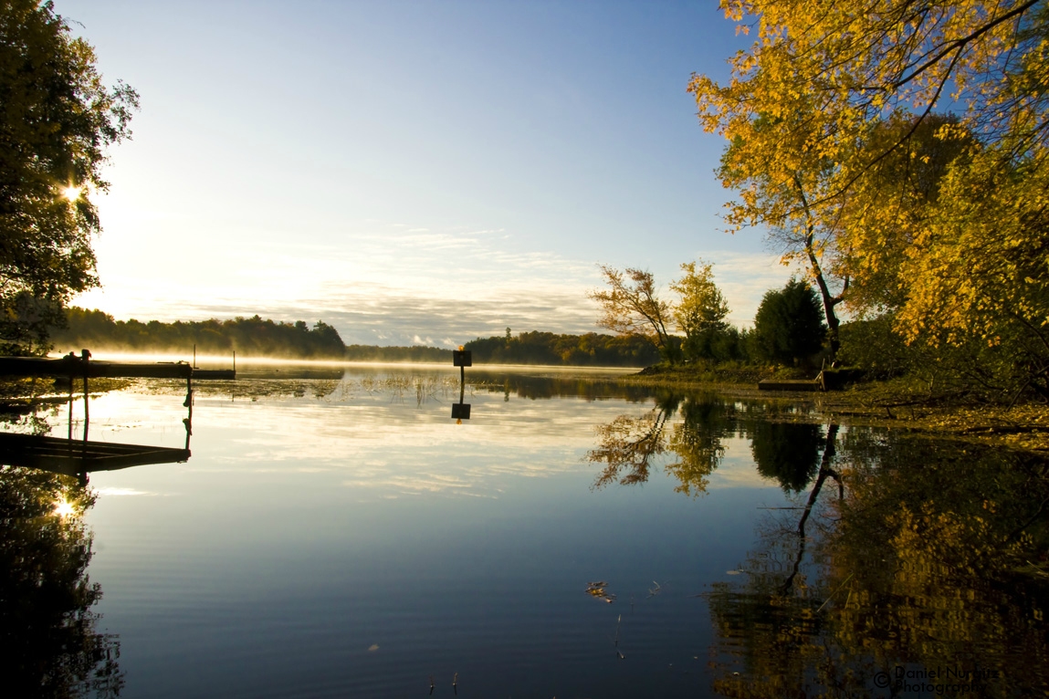 A bright, lakeside scene